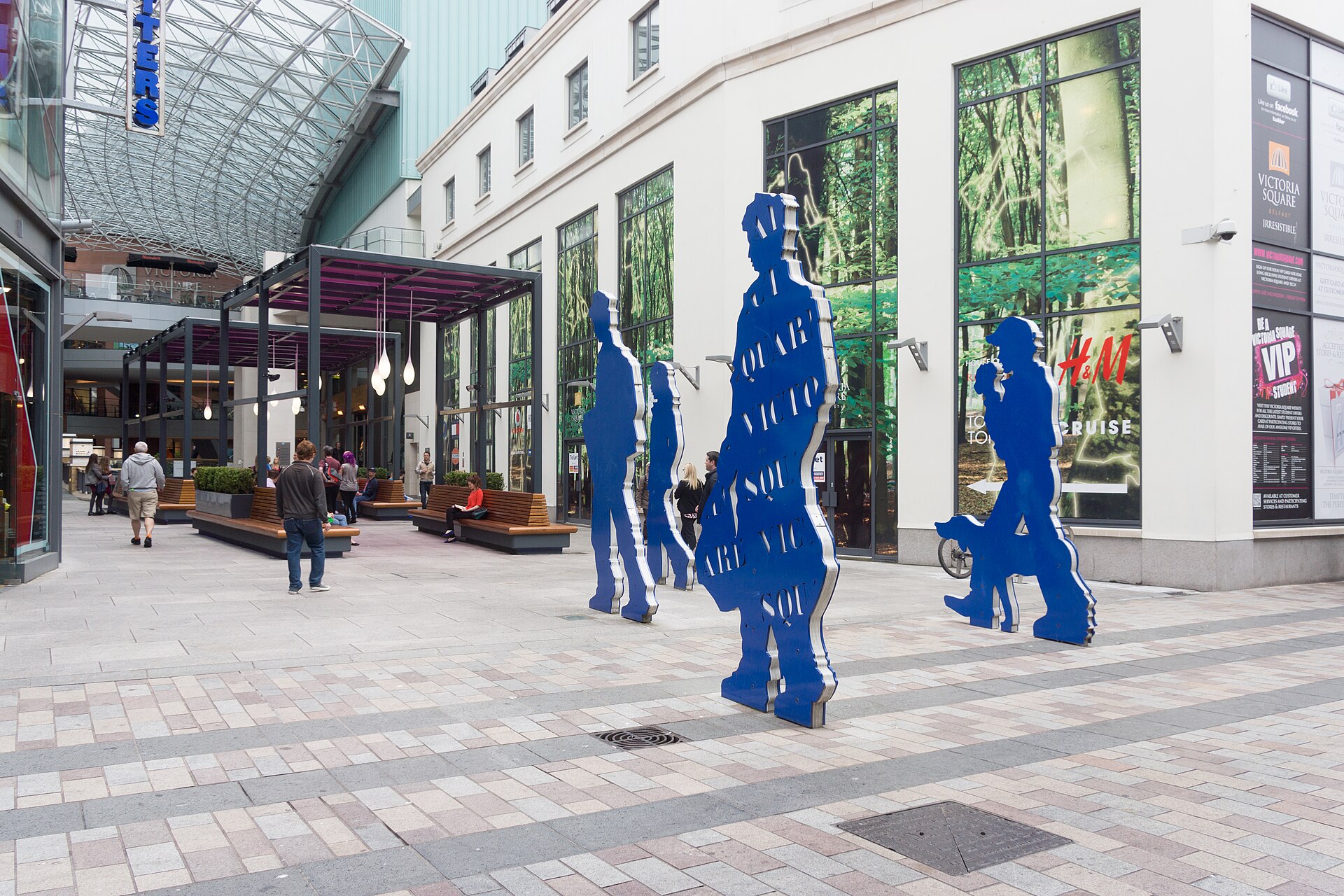 Shoppers walking through Victoria Square in Belfast city centre